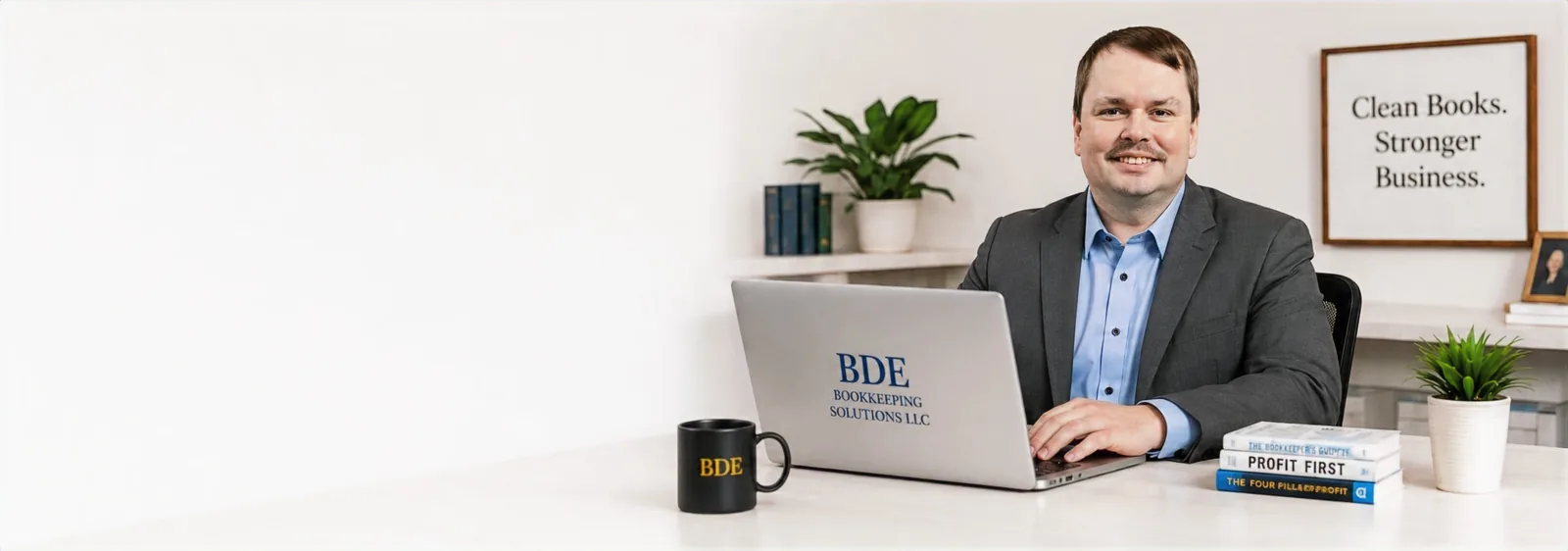 Billy Eldridge, owner of BDE Bookkeeping Solutions LLC, working at his desk